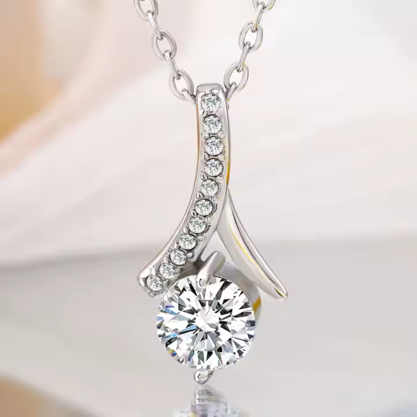 Celebrate love with the dazzling Alluring Necklace, featuring CZ stones and a ribbon pendant — a timeless gift for her to cherish.